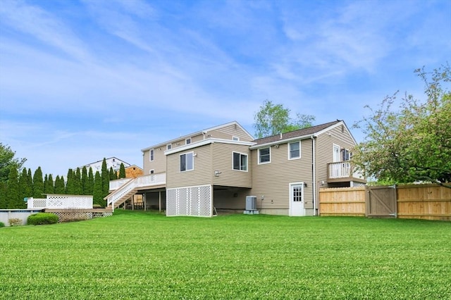 12 Jacobs Ave, Danvers, MA 01923 - back of house with stairs, central AC unit, a gate, and a deck
