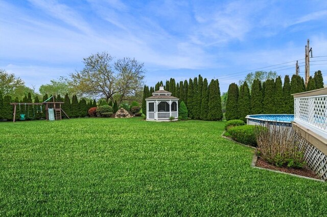 12 Jacobs Ave, Danvers, MA 01923 - view of green lawn featuring a gazebo and a playground