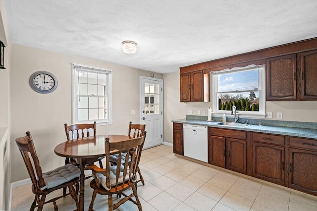 12 Jacobs Ave, Danvers, MA 01923 - kitchen featuring dishwasher, a sink, light tile patterned floors, and baseboards
