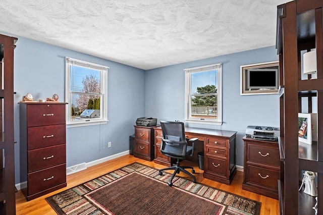 12 Jacobs Ave, Danvers, MA 01923 - office featuring light wood finished floors, a textured ceiling, and baseboards