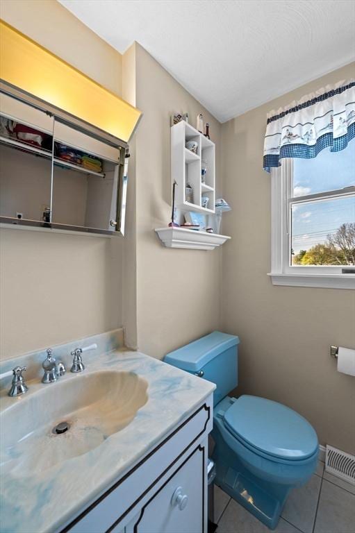 12 Jacobs Ave, Danvers, MA 01923 - bathroom featuring tile patterned floors, toilet, and vanity