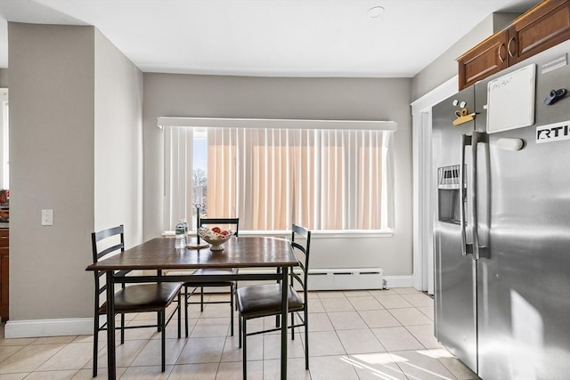 tiled dining area with baseboard heating