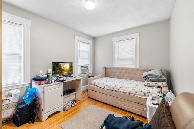 interior space featuring light hardwood / wood-style floors and cooling unit