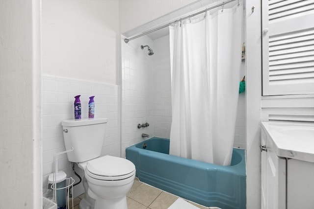 full bathroom featuring vanity, tile patterned floors, toilet, shower / bathtub combination with curtain, and tile walls