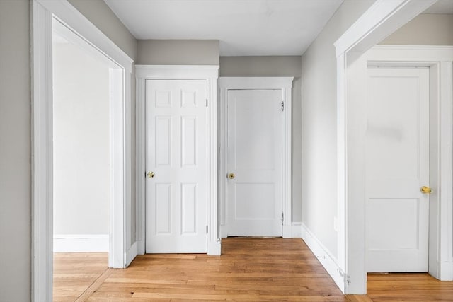 corridor featuring light hardwood / wood-style floors