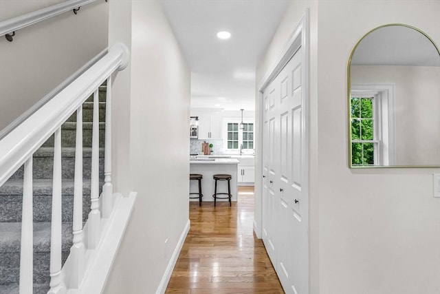 105 Forest Ave, Warren, MA 01585 - hallway with wood finished floors, stairway, and recessed lighting