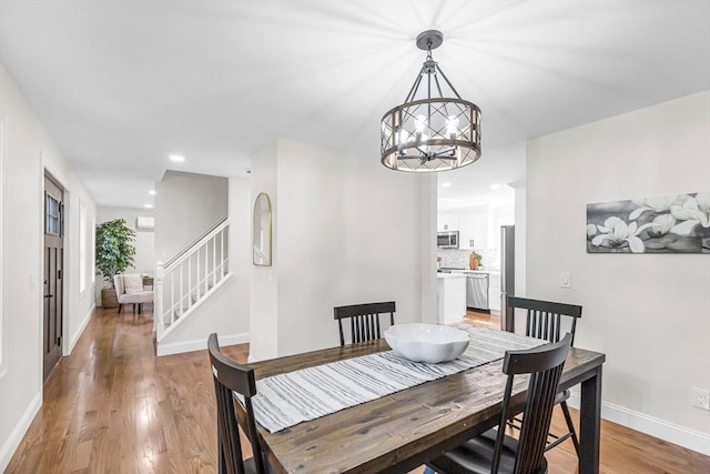 105 Forest Ave, Warren, MA 01585 - dining room with a chandelier, light wood-style floors, stairway, and recessed lighting