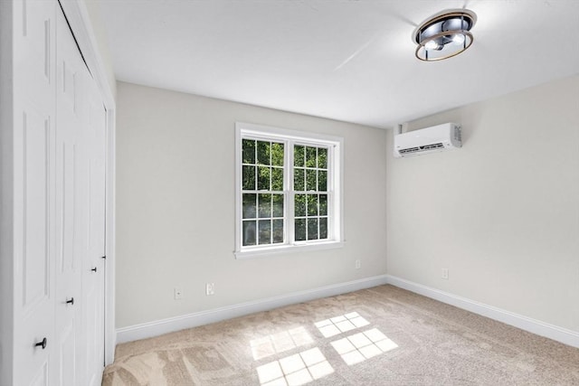 105 Forest Ave, Warren, MA 01585 - spare room featuring a wall mounted AC and light colored carpet