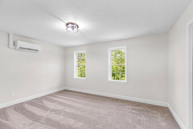 105 Forest Ave, Warren, MA 01585 - spare room with a wall mounted AC and carpet flooring