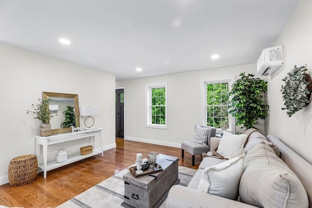 105 Forest Ave, Warren, MA 01585 - living area featuring an AC wall unit, wood finished floors, and recessed lighting
