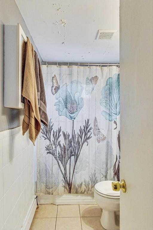 bathroom featuring tile patterned floors and toilet