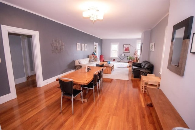 175 Winthrop Rd Unit 3, Brookline, MA 02445 - dining space with light wood-style floors, crown molding, and a chandelier