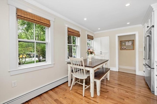 22 High St, Hingham, MA 02043 - dining space featuring baseboard heating, light wood-style flooring, ornamental molding, baseboards, and recessed lighting
