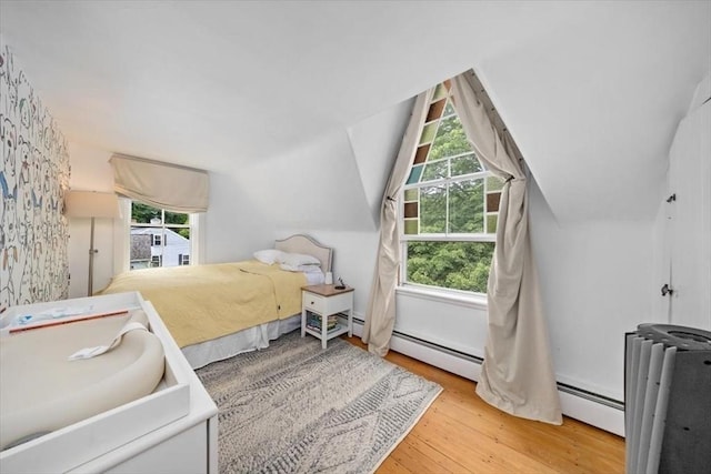 22 High St, Hingham, MA 02043 - bedroom featuring wood finished floors, baseboard heating, and lofted ceiling
