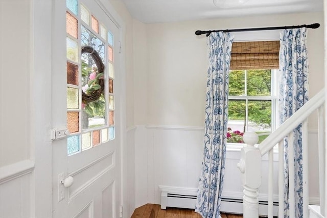 22 High St, Hingham, MA 02043 - doorway to outside with plenty of natural light, a wainscoted wall, a decorative wall, and wood finished floors