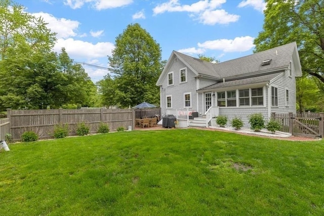 22 High St, Hingham, MA 02043 - back of property with roof with shingles, a patio area, and a gate