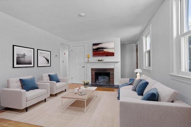living area with wood finished floors and a fireplace