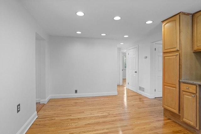 interior space featuring visible vents, recessed lighting, baseboards, and light wood-type flooring