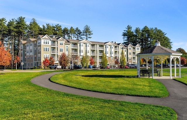 view of community featuring a lawn and a gazebo