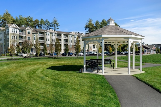 view of property's community featuring a yard and a gazebo