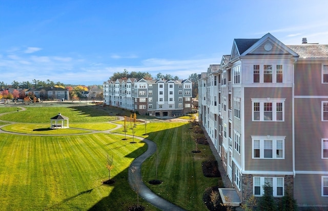 view of home's community featuring a lawn