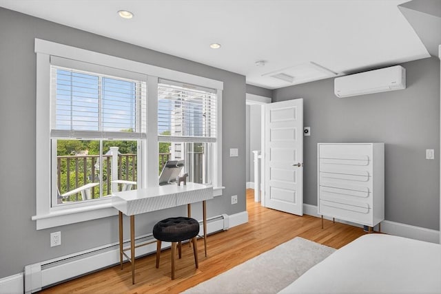53 W Vine St Unit A, Provincetown, MA 02657 - bedroom with an AC wall unit, a baseboard heating unit, wood finished floors, and recessed lighting