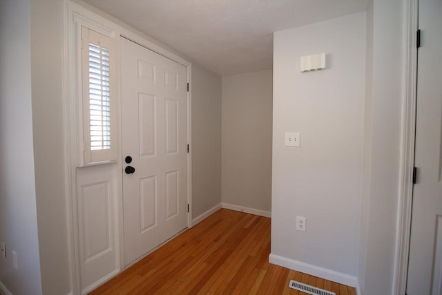 entrance foyer with light hardwood / wood-style flooring