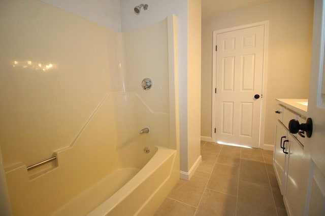 bathroom with vanity, bathtub / shower combination, and tile patterned flooring