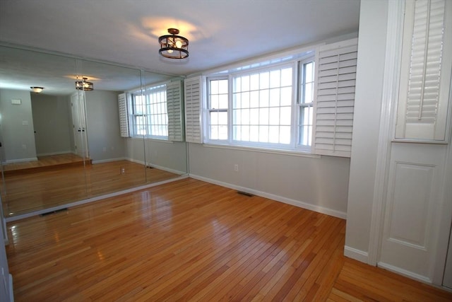 unfurnished room featuring wood-type flooring