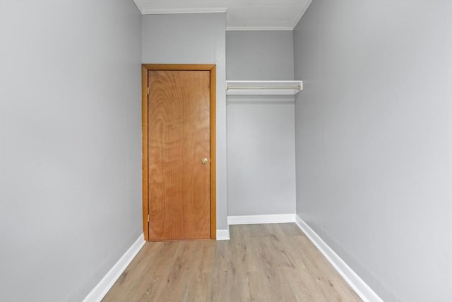 309 E Eagle St, Boston, MA 02128 - unfurnished bedroom featuring wood finished floors, baseboards, and ornamental molding