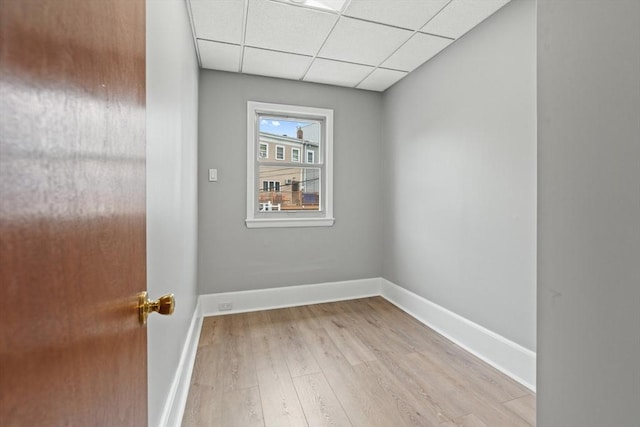 309 E Eagle St, Boston, MA 02128 - spare room featuring wood finished floors, a paneled ceiling, and baseboards