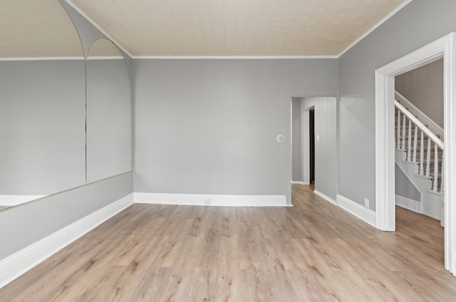 309 E Eagle St, Boston, MA 02128 - unfurnished room featuring ornamental molding, wood finished floors, baseboards, and stairs