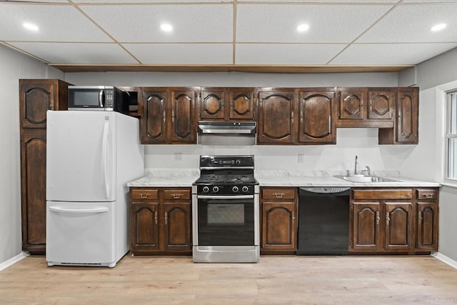 309 E Eagle St, Boston, MA 02128 - kitchen featuring freestanding refrigerator, black dishwasher, gas range oven, a sink, and a drop ceiling