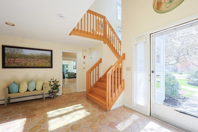 8 Fieldstone Ln Unit 0, Natick, MA 01760 - foyer featuring stairway, plenty of natural light, and a baseboard heating unit