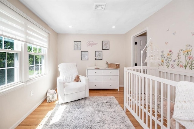 47 Patrick Rd Unit 47, Tewksbury, MA 01876 - bedroom featuring multiple windows, wood finished floors, a nursery area, baseboards, and recessed lighting