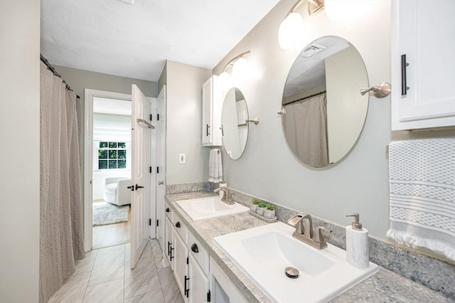 47 Patrick Rd Unit 47, Tewksbury, MA 01876 - bathroom featuring double vanity and marble finish flooring