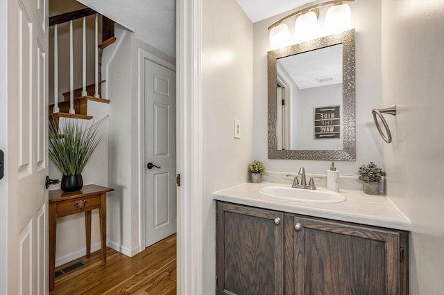 47 Patrick Rd Unit 47, Tewksbury, MA 01876 - bathroom with vanity, wood finished floors, and baseboards