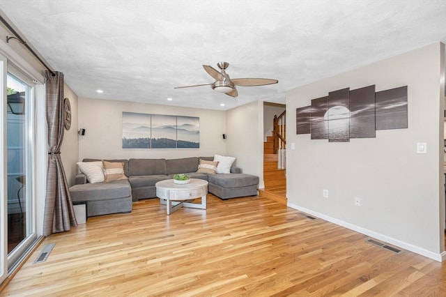 47 Patrick Rd Unit 47, Tewksbury, MA 01876 - living area featuring light wood-type flooring, a ceiling fan, stairs, baseboards, and recessed lighting