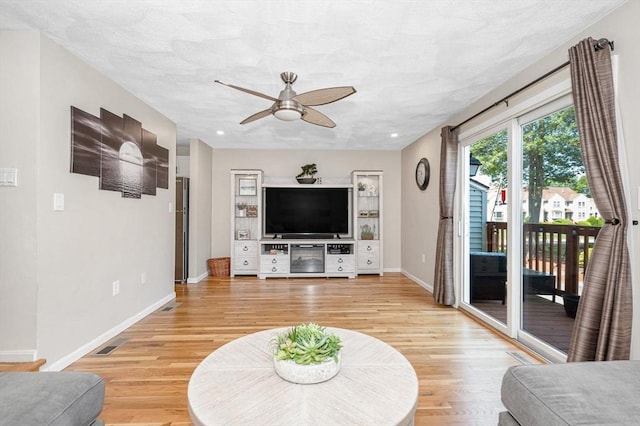 47 Patrick Rd Unit 47, Tewksbury, MA 01876 - living area featuring a ceiling fan, light wood finished floors, and baseboards