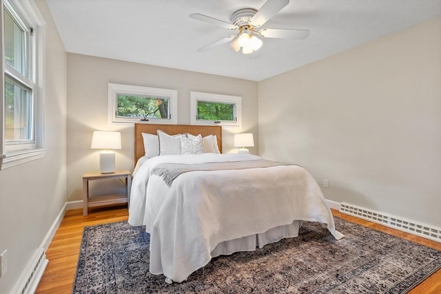 11 Anniversary Way, Billerica, MA 01821 - bedroom featuring light wood-type flooring, a baseboard radiator, and ceiling fan