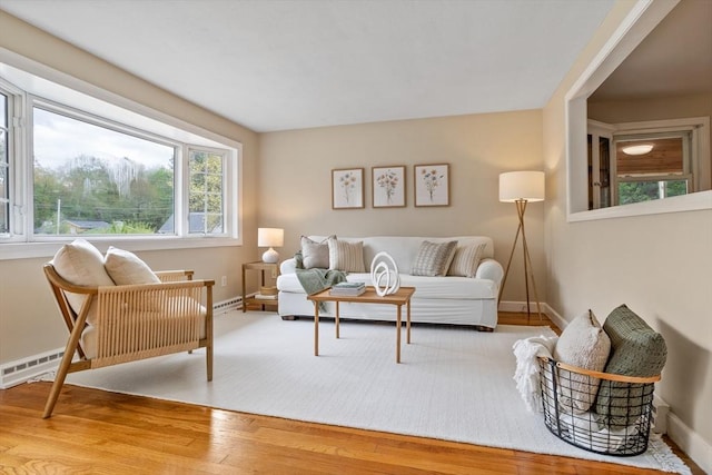 11 Anniversary Way, Billerica, MA 01821 - living area featuring wood finished floors and baseboard heating