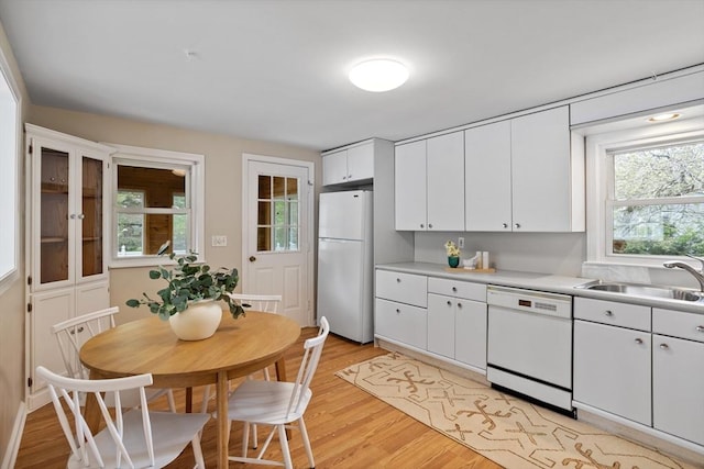 11 Anniversary Way, Billerica, MA 01821 - kitchen featuring white appliances, light wood-style floors, white cabinetry, and light countertops