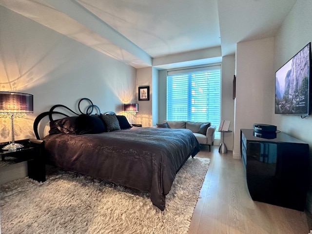 bedroom with hardwood / wood-style floors