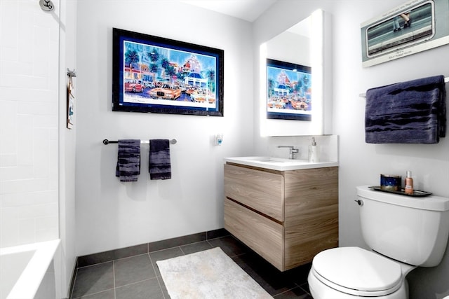 full bathroom with tile patterned flooring, vanity, tiled shower / bath combo, and toilet