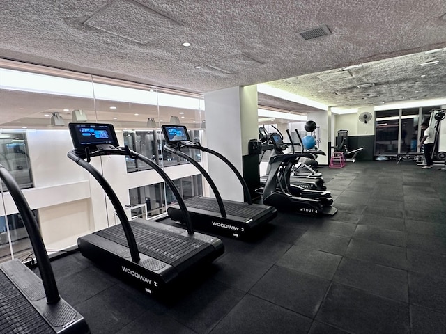 workout area with a textured ceiling