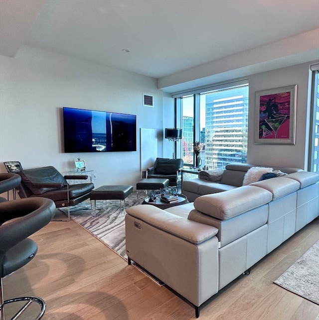 living room with light hardwood / wood-style floors