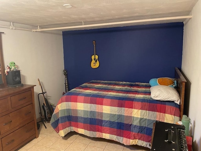 bedroom with light tile patterned flooring