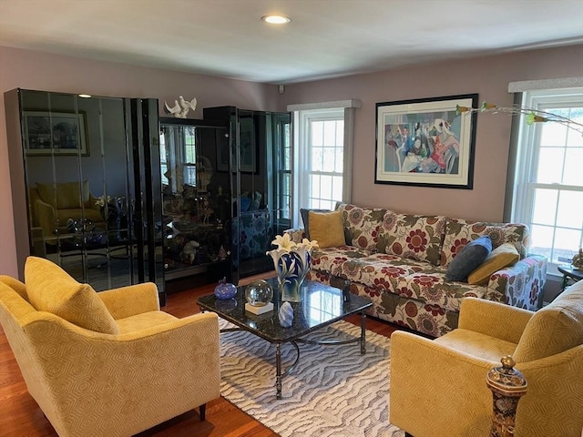 living area with recessed lighting and wood finished floors