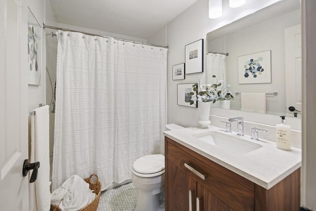 bathroom with vanity, toilet, and a shower with shower curtain