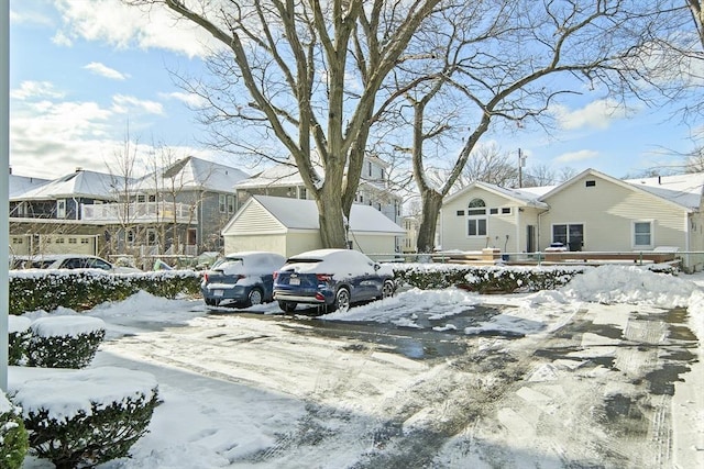 view of snow covered parking